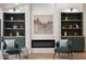 Cozy living area featuring built-in shelving, fireplace, and comfortable seating at 10634 E Cedar Waxwing Dr, Sun Lakes, AZ 85248