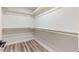 Spacious walk-in closet offering ample storage and hardwood flooring at 10634 E Cedar Waxwing Dr, Sun Lakes, AZ 85248