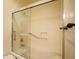 Modern bathroom with glass-enclosed shower, grab bars, and convenient accessibility features for comfort and safety at 10655 N 9Th St # 207, Phoenix, AZ 85020