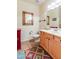 Spacious bathroom with a tile floor, wooden vanity and decorative mirror giving the room a modern touch at 10655 N 9Th St # 207, Phoenix, AZ 85020