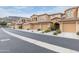 Beautiful townhome exterior featuring a private garage, tiled roof, and desert landscaping at 10655 N 9Th St # 207, Phoenix, AZ 85020