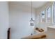 Bright foyer with elegant light fixture and staircase leading upstairs at 10655 N 9Th St # 207, Phoenix, AZ 85020