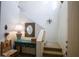 Bright hallway with stylish decor, staircase, and unique lighting fixtures at 10655 N 9Th St # 207, Phoenix, AZ 85020