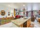 Stylish kitchen island with bar seating, stainless steel appliances, and abundant counter space at 10655 N 9Th St # 207, Phoenix, AZ 85020