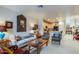Inviting living room features cozy seating, decorative mirror, and seamless flow into the kitchen area at 10655 N 9Th St # 207, Phoenix, AZ 85020