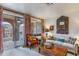 Bright living room with sliding glass doors to the outside balcony and decorative accents at 10655 N 9Th St # 207, Phoenix, AZ 85020