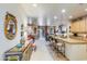 Open living space with a kitchen bar and seamless flow between living room and dining at 10655 N 9Th St # 207, Phoenix, AZ 85020