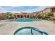 Upscale community pool and hot tub area surrounded by manicured landscaping and resort-style amenities at 10655 N 9Th St # 207, Phoenix, AZ 85020