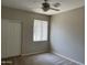 Bedroom featuring carpet flooring, closet, and a ceiling fan at 11500 E Cochise Dr # 1063, Scottsdale, AZ 85259