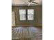 Bedroom featuring neutral walls, carpet flooring, and bright windows at 11500 E Cochise Dr # 1063, Scottsdale, AZ 85259