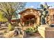 Stunning clubhouse exterior with desert landscaping, complete with a statue and attractive facade at 11500 E Cochise Dr # 1063, Scottsdale, AZ 85259