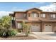 Charming townhome featuring a terracotta roof, attached garage and desert landscaping at 11500 E Cochise Dr # 1063, Scottsdale, AZ 85259