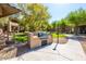 Community outdoor grilling area with built-in barbecue and well maintained landscaping at 11500 E Cochise Dr # 1063, Scottsdale, AZ 85259
