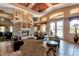 Inviting living room featuring a stone fireplace, vaulted ceilings, and comfortable seating at 11500 E Cochise Dr # 1063, Scottsdale, AZ 85259