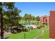 Upper level view of community pool, golf course, and desert landscaping at 12212 N Paradise Village S Pkwy # 444, Phoenix, AZ 85032