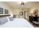 Bright bedroom featuring a comfortable king-size bed, neutral color palette, and standard ceiling fan at 12212 N Paradise Village S Pkwy # 444, Phoenix, AZ 85032