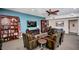 Cozy community room seating area with comfortable leather chairs, bookshelves, and a large television at 12212 N Paradise Village S Pkwy # 444, Phoenix, AZ 85032