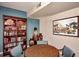 Detailed view of community room decor, featuring bookshelves, vases, and artwork at 12212 N Paradise Village S Pkwy # 444, Phoenix, AZ 85032
