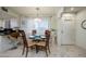Cozy dining area with seating for four, complemented by a stylish chandelier and natural light at 12212 N Paradise Village S Pkwy # 444, Phoenix, AZ 85032