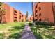 Beautiful landscaped community with walking path between buildings on a sunny day at 12212 N Paradise Village S Pkwy # 444, Phoenix, AZ 85032