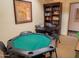 This cozy game room features a poker table, a small card table, and a book shelf at 12212 N Paradise Village S Pkwy # 444, Phoenix, AZ 85032