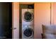 Convenient laundry closet with stacked washer and dryer at 12212 N Paradise Village S Pkwy # 444, Phoenix, AZ 85032
