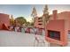 Exterior of the community surrounding the pool and a fireplace at 12212 N Paradise Village S Pkwy # 444, Phoenix, AZ 85032