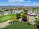 Beautiful aerial view featuring a golf course, scenic lake, and an expansive community at 12939 W Prospect Dr, Sun City West, AZ 85375