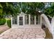 Enclosed backyard patio with a unique paved floor and lots of shade to stay cool at 12939 W Prospect Dr, Sun City West, AZ 85375