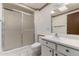 Traditional bathroom with a vanity, toilet, and a frosted glass shower stall at 12939 W Prospect Dr, Sun City West, AZ 85375