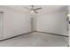 Bright bedroom with a ceiling fan and natural light from two windows at 12939 W Prospect Dr, Sun City West, AZ 85375