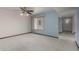 Spacious bedroom with carpet, and a ceiling fan, offering natural light and a tranquil atmosphere at 12939 W Prospect Dr, Sun City West, AZ 85375