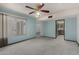Comfortable bedroom with carpet, blue walls, natural light, and easy access to other areas at 12939 W Prospect Dr, Sun City West, AZ 85375