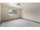 Bright bedroom with a large window offering a view of the outdoors at 12939 W Prospect Dr, Sun City West, AZ 85375
