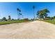 Scenic golf course view featuring sand traps and mature trees under a clear blue sky at 12939 W Prospect Dr, Sun City West, AZ 85375