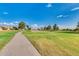 Picturesque golf course featuring a paved cart path winding through the lush green landscape at 12939 W Prospect Dr, Sun City West, AZ 85375