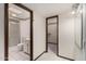 Hallway with entrances to a bathroom and a walk in closet at 12939 W Prospect Dr, Sun City West, AZ 85375
