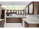 Functional kitchen with ample counter space, wood cabinets, and modern appliances for cooking at 12939 W Prospect Dr, Sun City West, AZ 85375