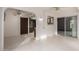 Open-concept living room with tile flooring leading to the kitchen, ideal for modern living at 12939 W Prospect Dr, Sun City West, AZ 85375