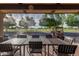 An inviting outdoor patio with tables and a view of the beautiful golf course at 12939 W Prospect Dr, Sun City West, AZ 85375