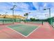 Outdoor pickleball courts with lighting and benches in a well-maintained community area at 12939 W Prospect Dr, Sun City West, AZ 85375