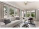 Bright sunroom with large windows, comfortable seating, and natural light at 12939 W Prospect Dr, Sun City West, AZ 85375