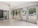 Spacious sunroom with many windows, tile floors, and access to the outdoors, offering natural light at 12939 W Prospect Dr, Sun City West, AZ 85375