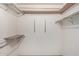 Spacious walk-in closet with multiple shelves and racks for ample storage at 12939 W Prospect Dr, Sun City West, AZ 85375