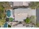 Stunning aerial view of a property showcasing a lush backyard oasis with pool and putting green at 16044 N 106Th Way, Scottsdale, AZ 85255