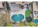 Backyard oasis showcasing pool, putting green, outdoor kitchen, lounge chairs, and privacy at 16044 N 106Th Way, Scottsdale, AZ 85255