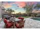 Beautiful backyard with an outdoor kitchen, dining area, putting green, and refreshing pool at 16044 N 106Th Way, Scottsdale, AZ 85255