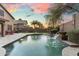 Stunning backyard pool with water feature, BBQ, and outdoor dining at 16044 N 106Th Way, Scottsdale, AZ 85255