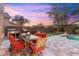 Spacious backyard with a putting green, outdoor kitchen, dining, and pool at 16044 N 106Th Way, Scottsdale, AZ 85255
