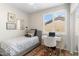 Bedroom featuring a ceiling fan, plantation shutters, work space, and comfortable decor at 16044 N 106Th Way, Scottsdale, AZ 85255